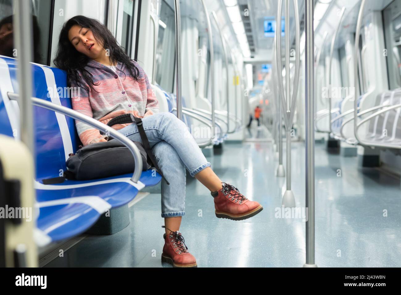 Young woman passenger sleeping in subway car Stock Photo - Alamy