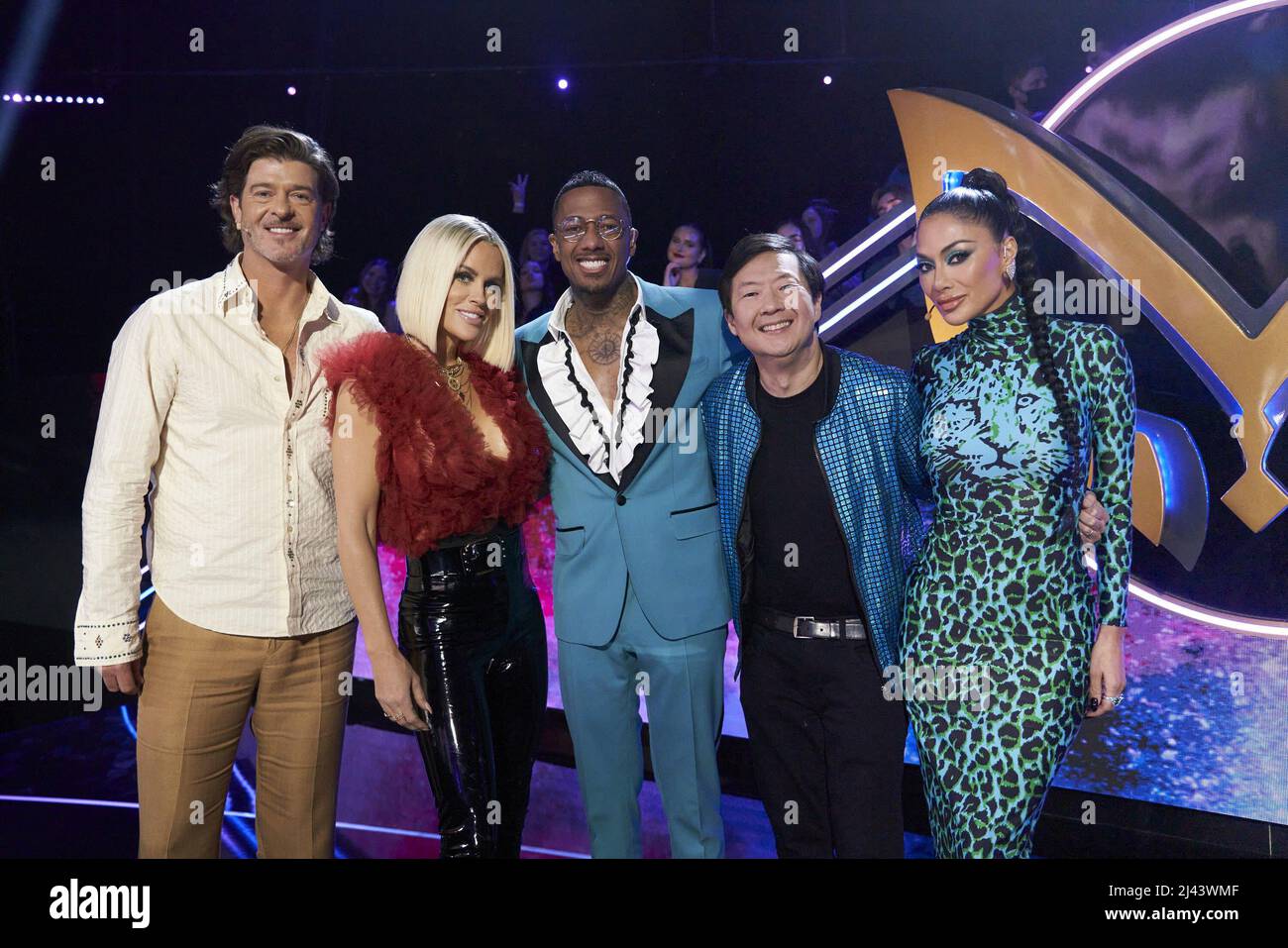 THE MASKED SINGER, from left: judges Robin Thicke, Jenny McCarthy, host  Nick Cannon, judge Ken Jeong, Nicole Scherzinger, Masks at Dawn Round 1',  (Season 7, ep. 702, aired Mar. 16, 2022). photo: