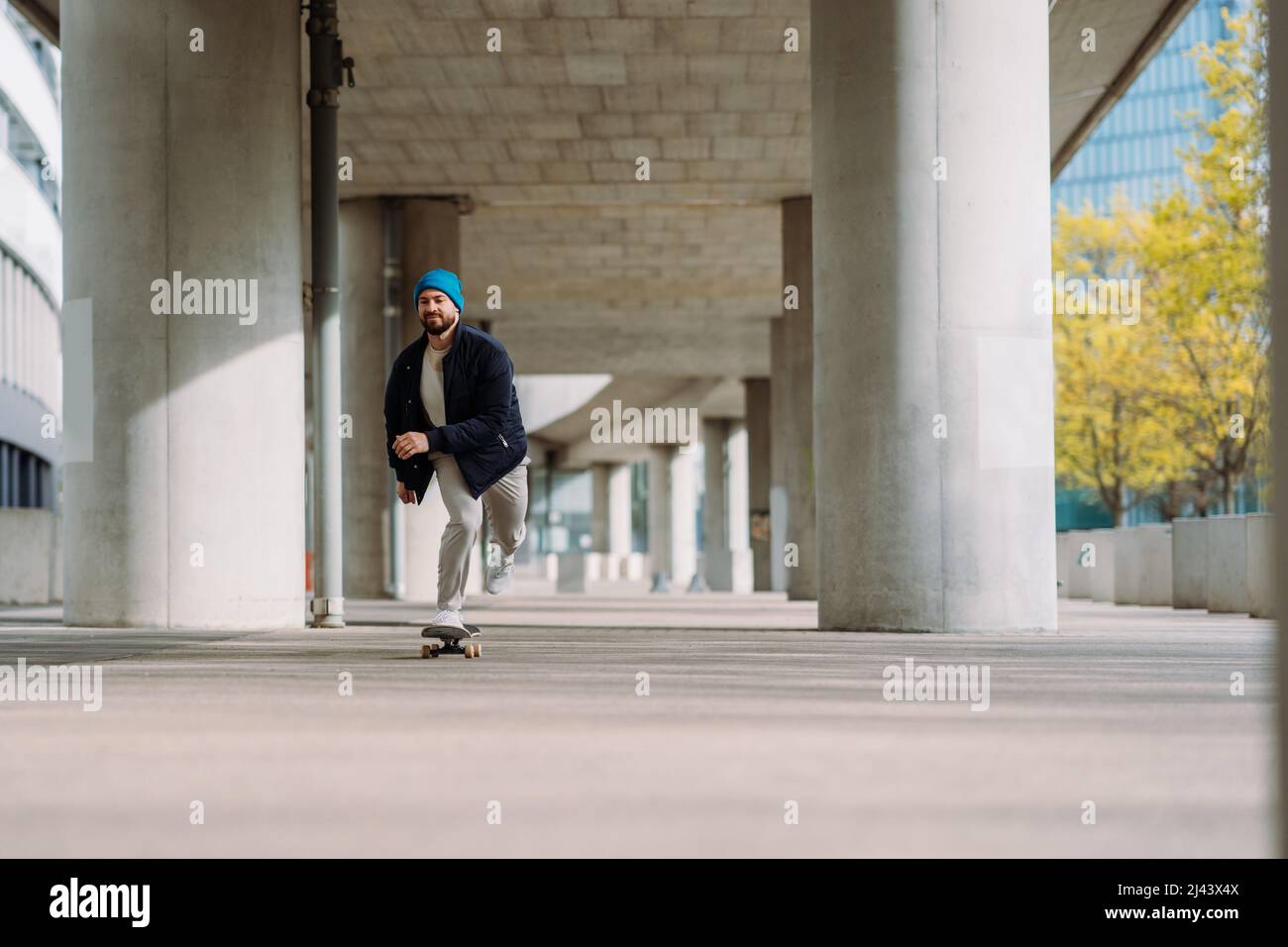 skateboarding boy in the city . Urban architecture. Skate spot. Copy space  Stock Photo - Alamy