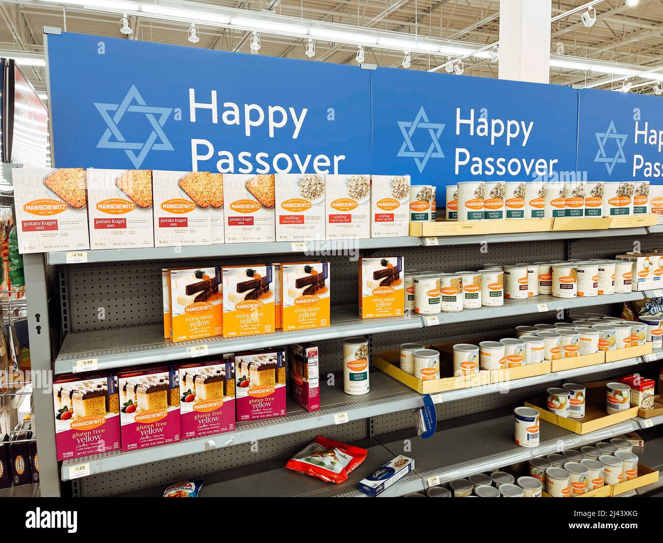 Toronto, Ontario, Canada - April 10, 2022: Happy Passover sign in store grocery shop Walmart. Shelves with food for Jewish spring traditional cultural Stock Photo