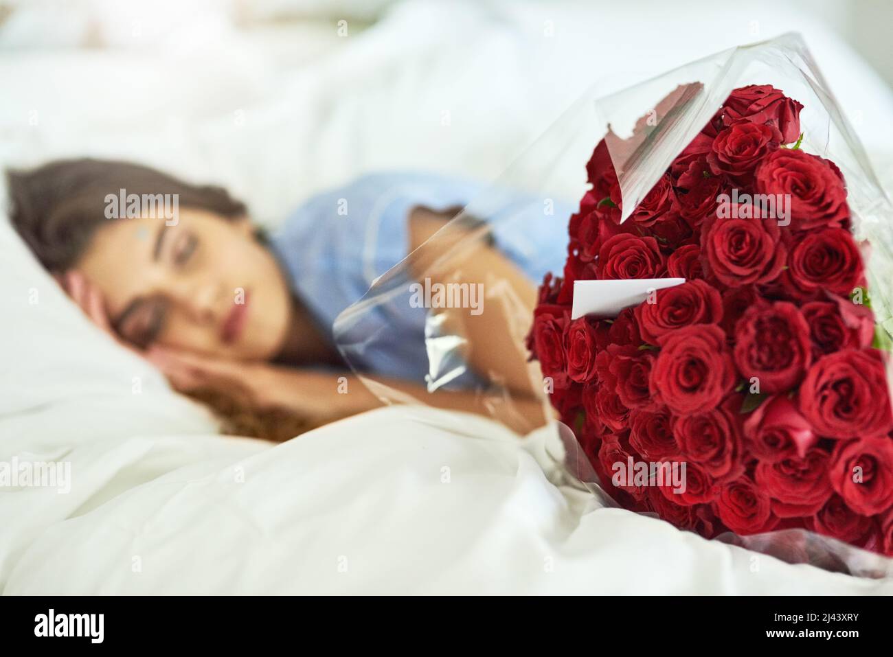 Woman lying with roses hi-res stock photography and images - Alamy