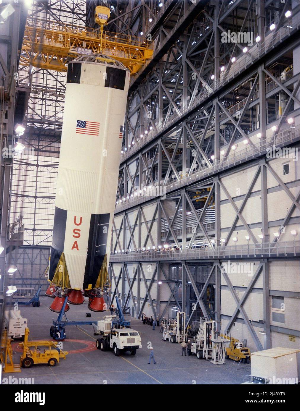 The first stage of a Saturn V rocket being erected in the Vehicle Assembly Building at Kennedy Space Center Stock Photo