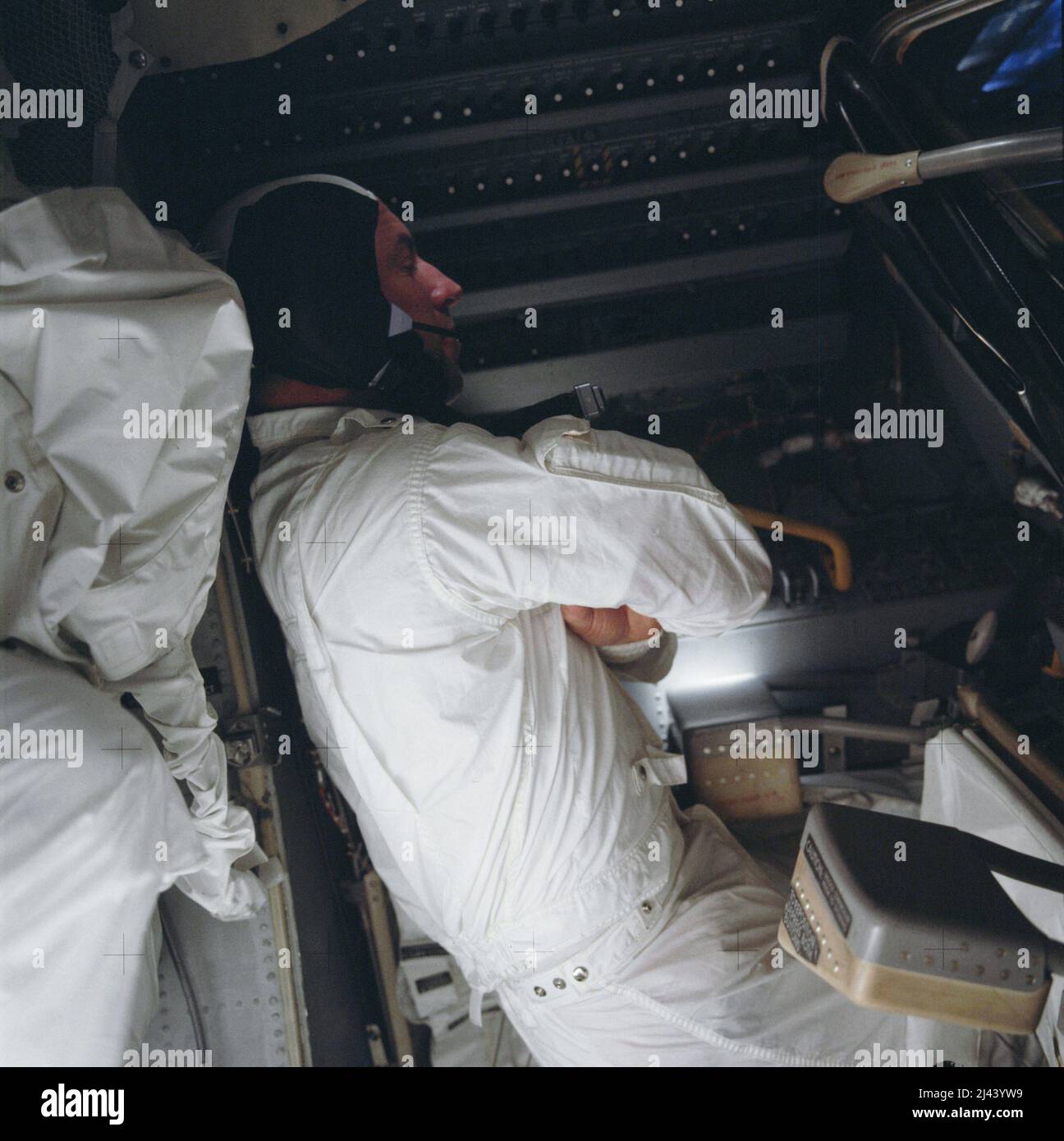 Astronaut James Lovell tries to rest in the frigid spacecraft during the return journey of Apollo 13 Stock Photo