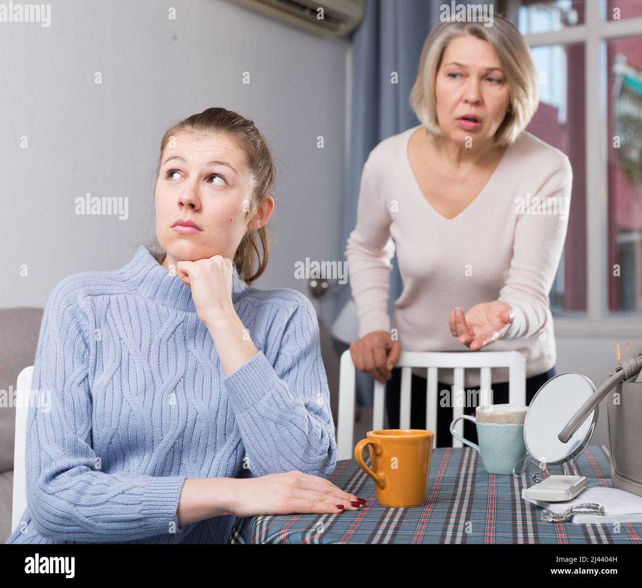 Mature Mother Scolds Adult Daughter Stock Photo Alamy