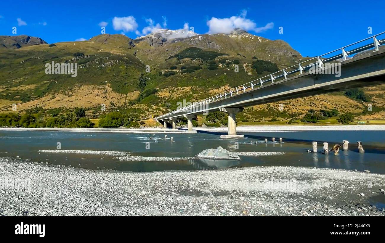 The main road between Glenorchy and Lake Sylvan cross a road bridge across the stunning river in nature Stock Photo