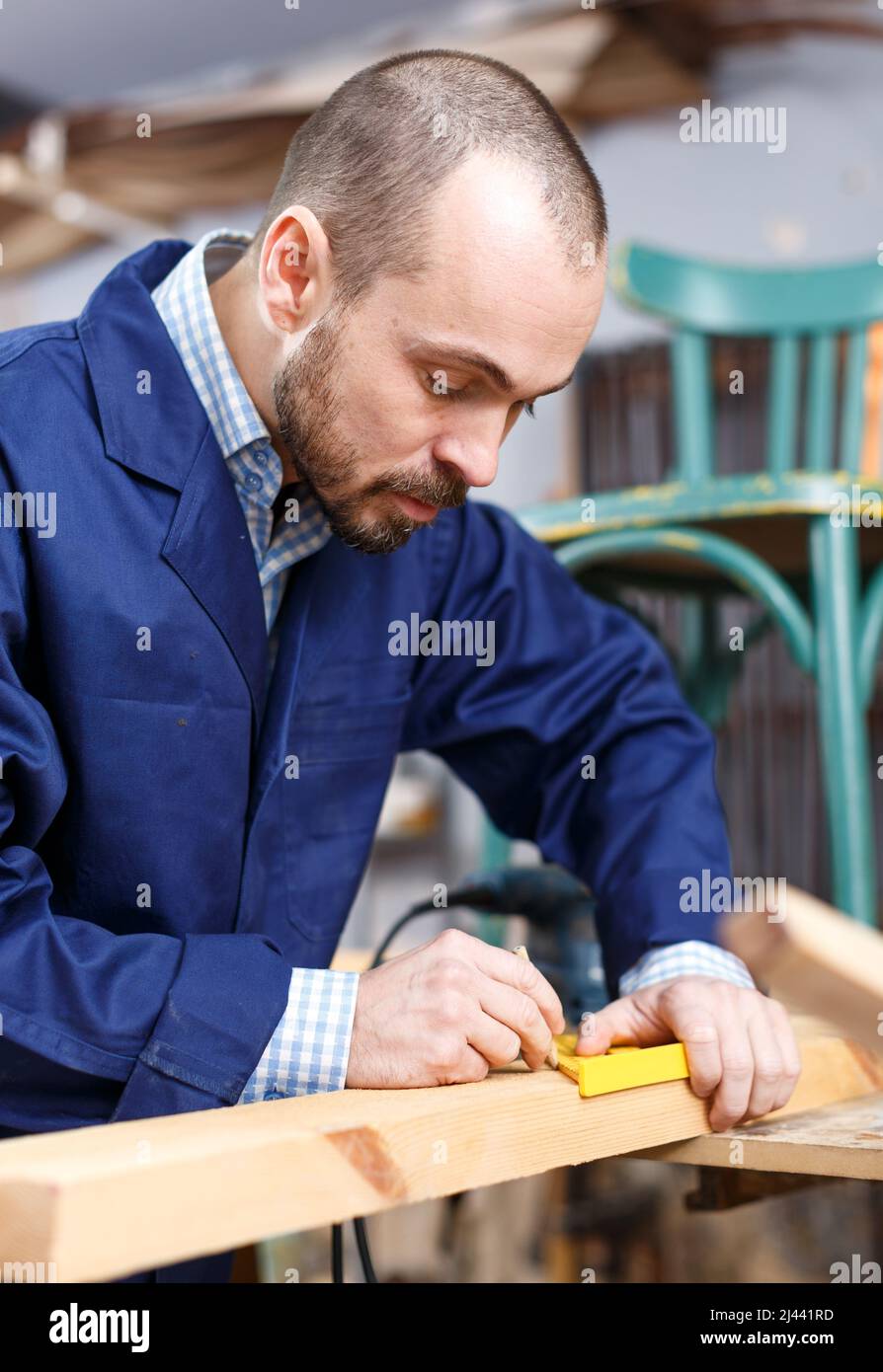 Carpenter using tools for creating furniture Stock Photo Alamy