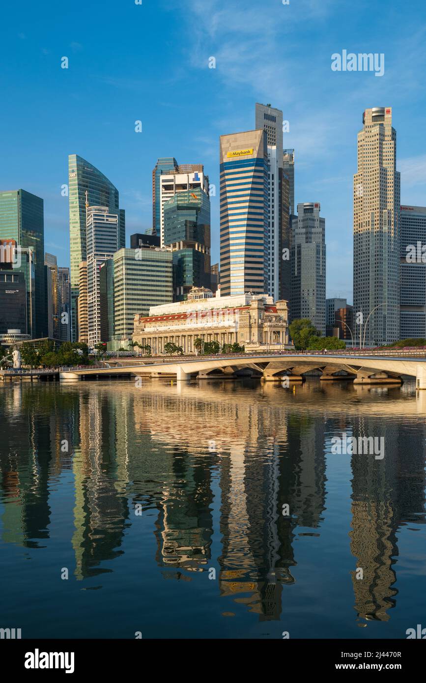 The Singapore Skyline with the iconic Fullerton Hotel set against a backdrop of the office buildings in the Central Business District of the city. Stock Photo