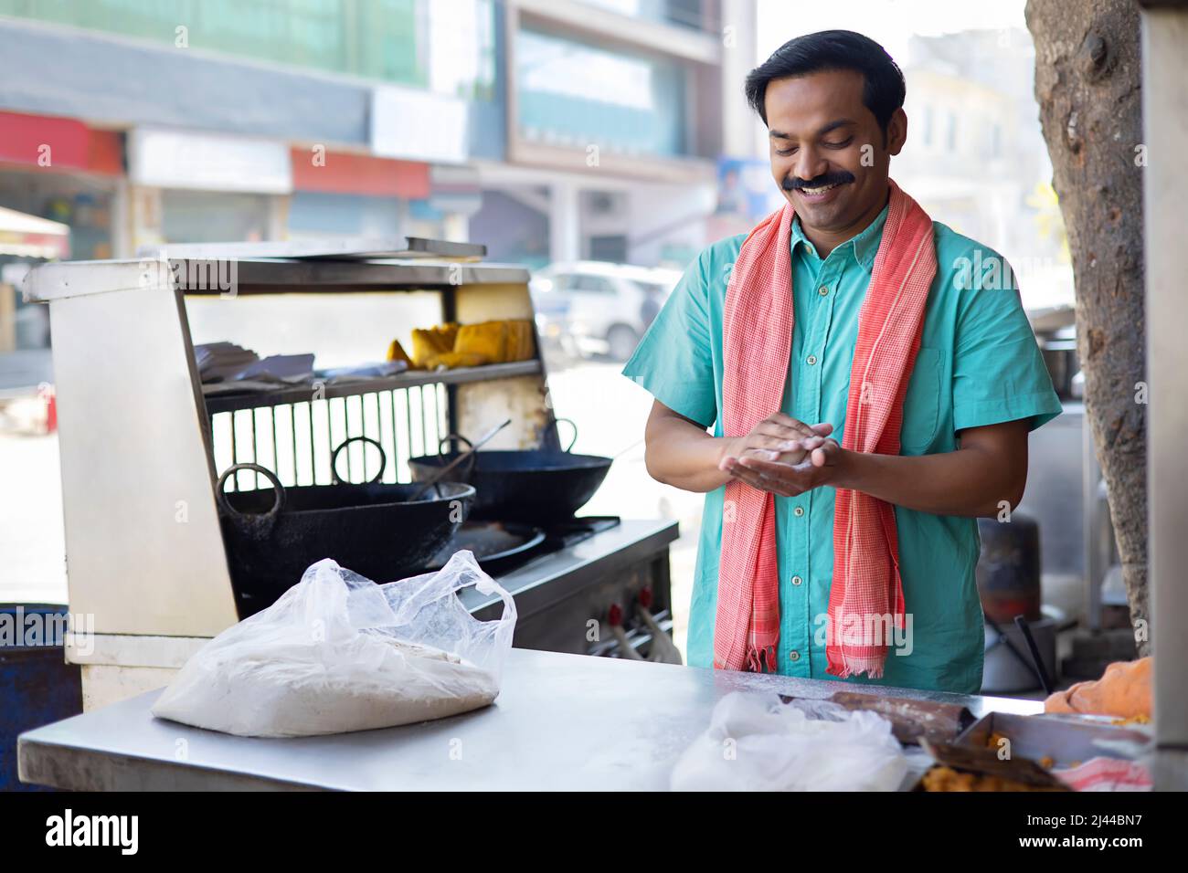 Street food vendor making flour dough by hand Stock Photo Alamy