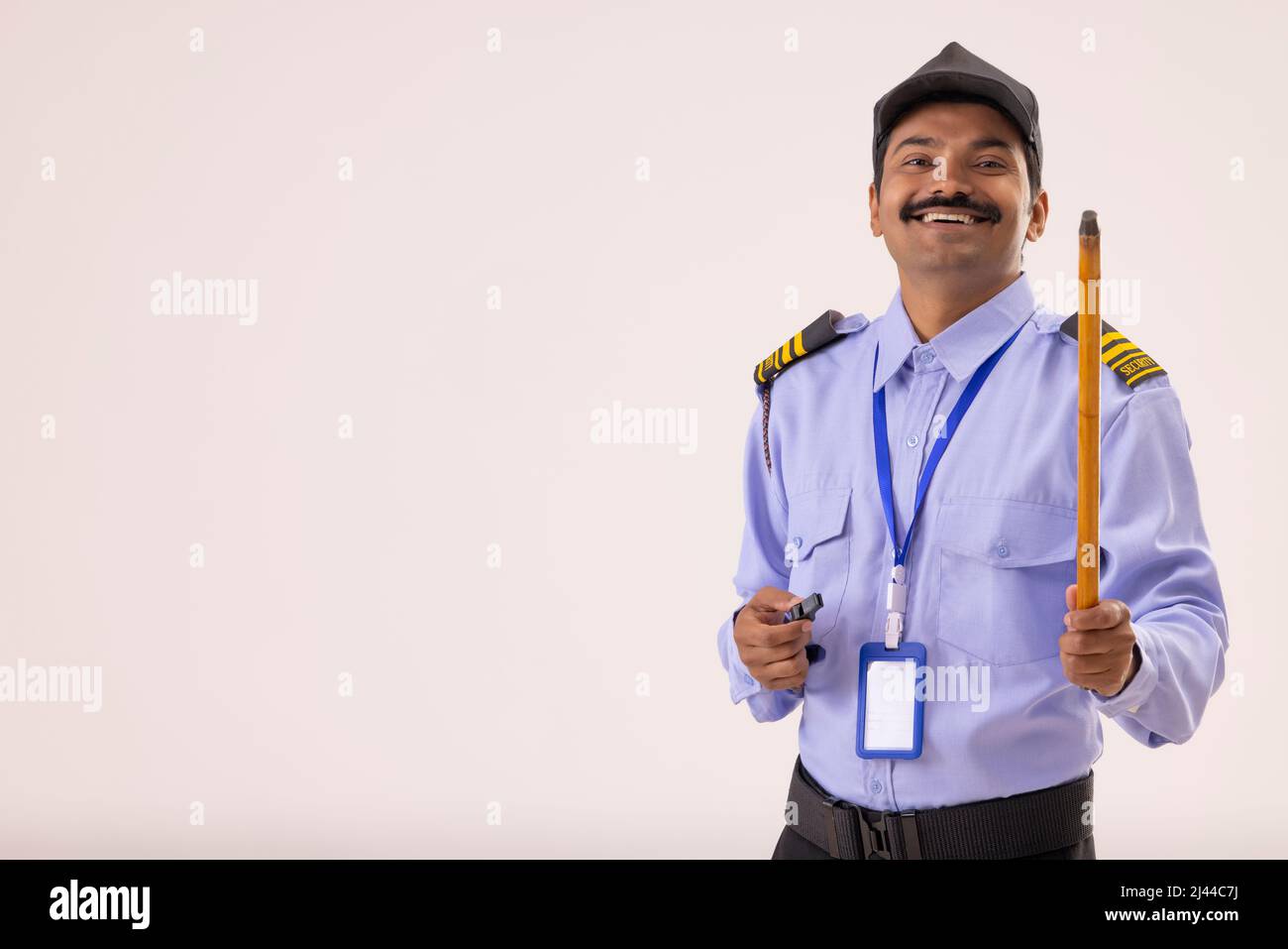 Portrait of Security guard with whistle and stick in his hands Stock Photo