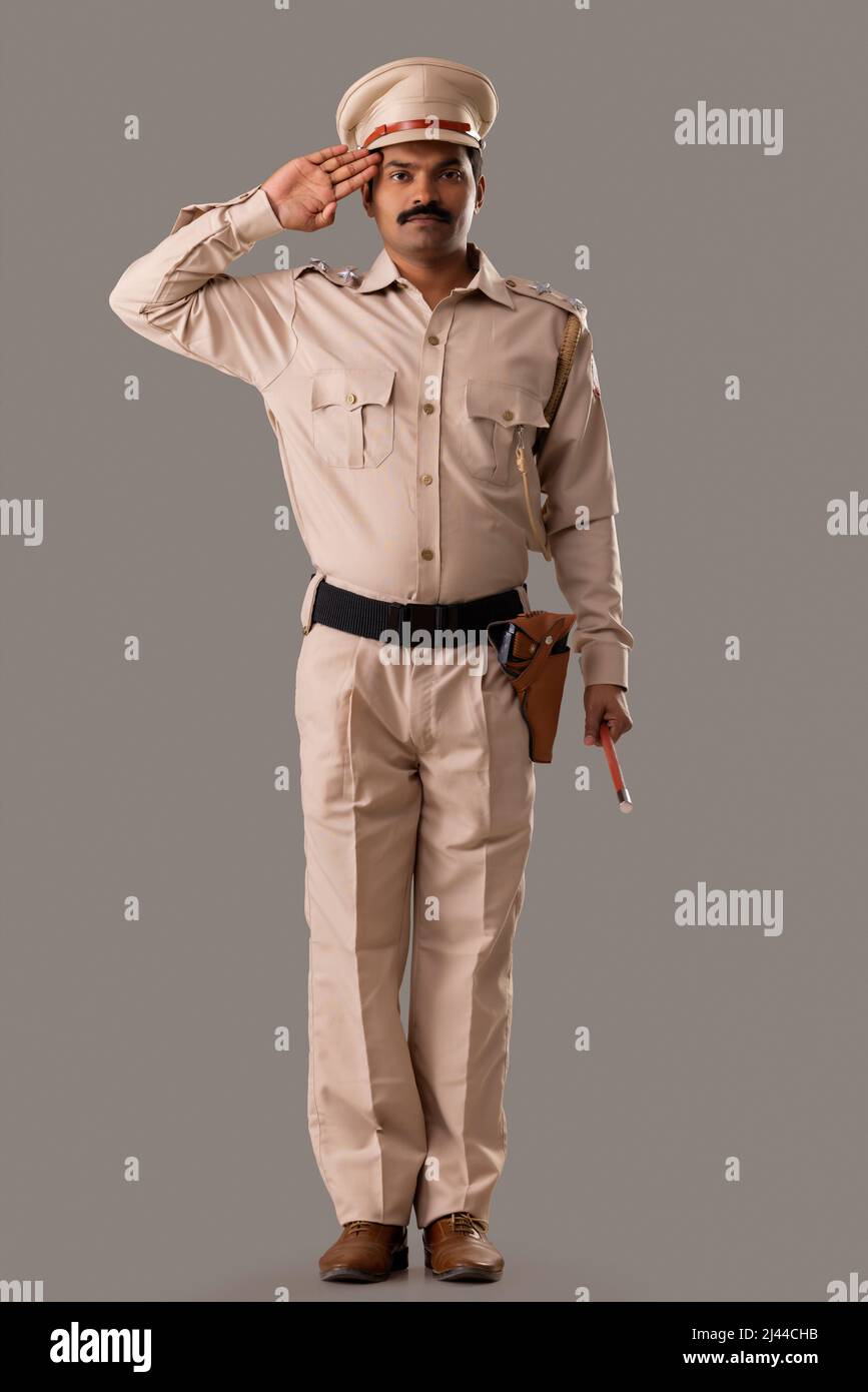 Portrait of an Indian policeman saluting Stock Photo