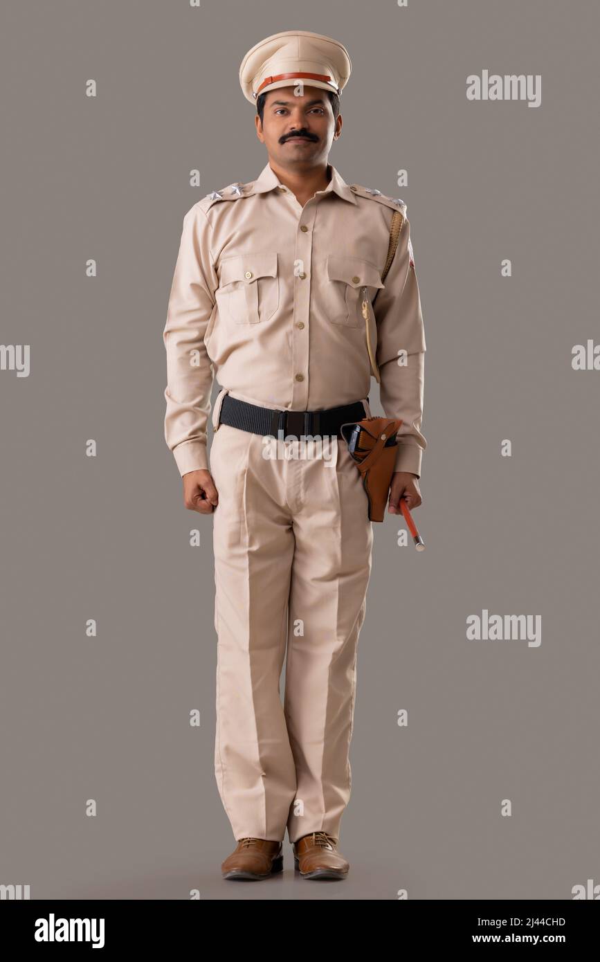 Portrait of an Indian policeman standing Stock Photo