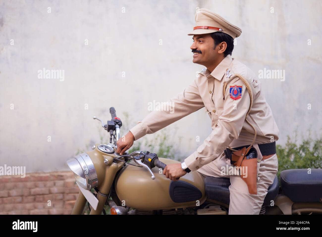 Portrait of an Indian policeman on bike Stock Photo
