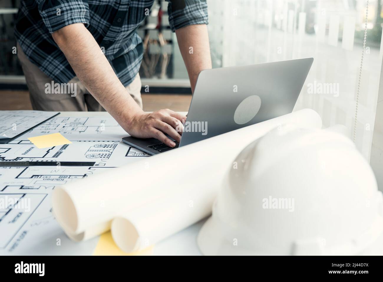 Architect working new project and using laptop with in office. Stock Photo
