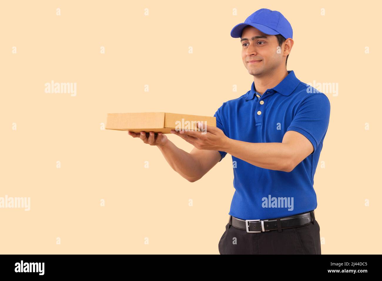 Portrait of a courier delivery boy with parcel Stock Photo