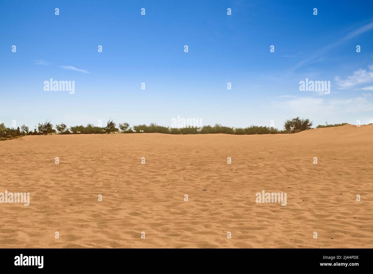 Views of sand dune with a blue sky background Stock Photo - Alamy