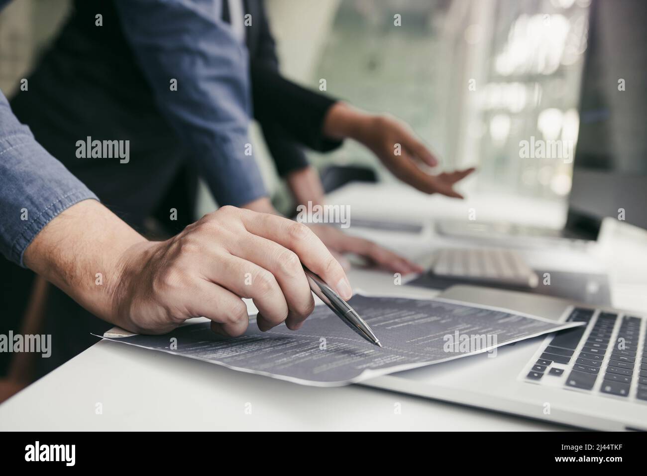 Developing programming and coding technologies working in a software engineers developing applications together in office. Stock Photo