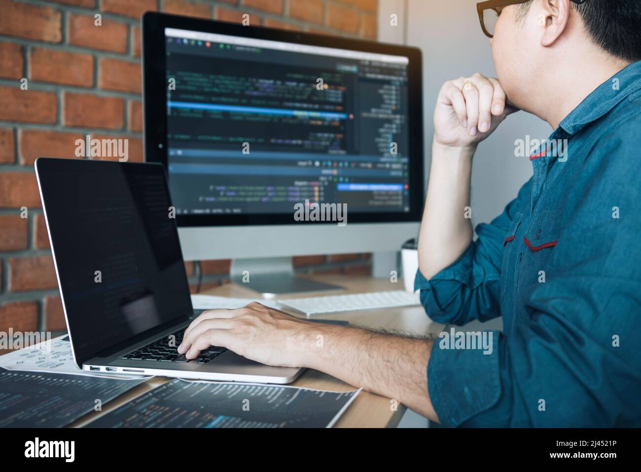 Developing programming and coding technology working in a software develop company office. Stock Photo