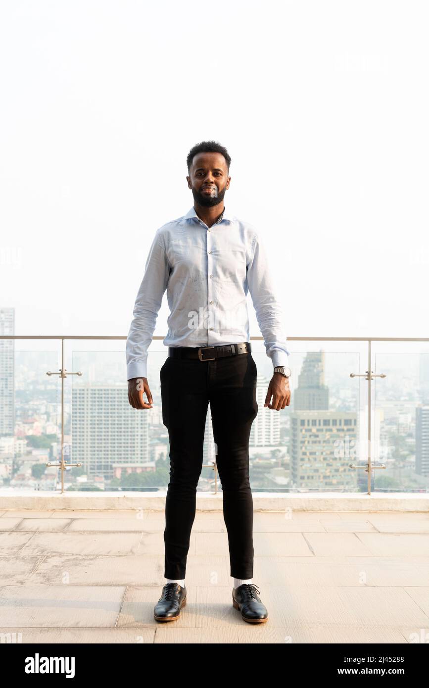 Portrait of handsome young African man outdoors Stock Photo