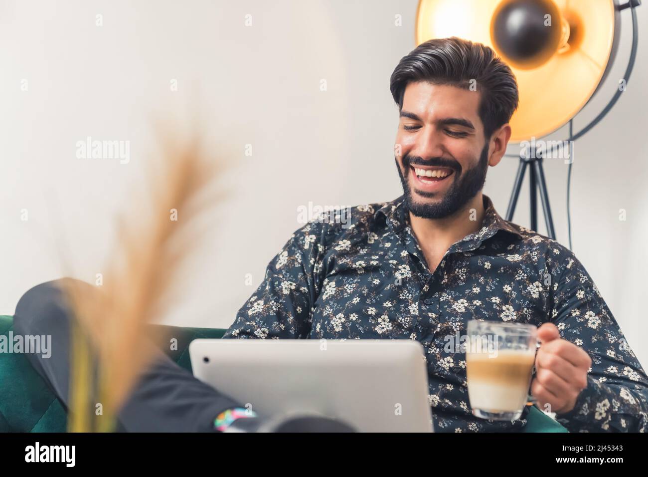 man enjoying with his coffee break at home remote job concept wellbeing concept medium shot indoors. High quality photo Stock Photo