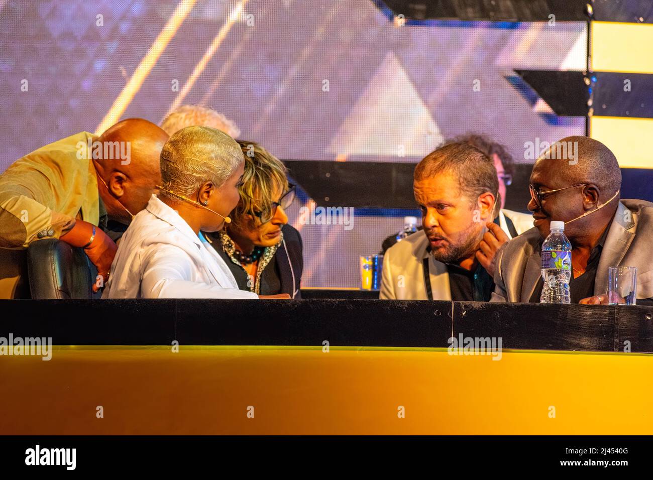 National jury deliberates during the show. In white, Haila Maria Mompie. In the center, Jorgito Caramba. Speaking, David Torrens. The event is held in Stock Photo