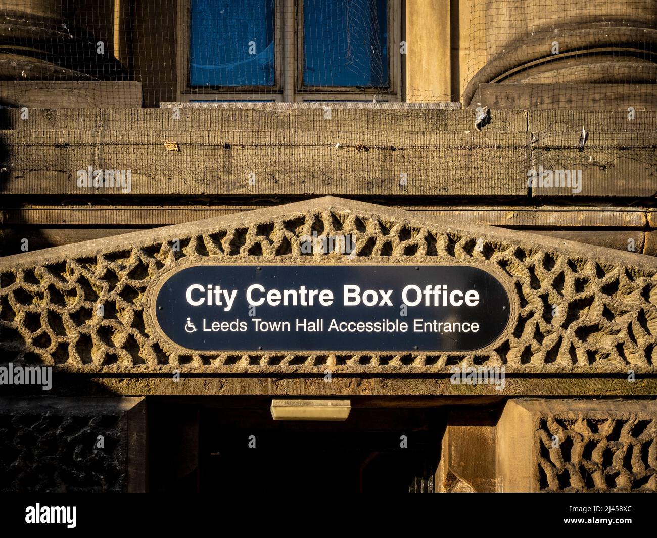 Closeup of door sign for Leeds Town Hall wheelchair Accessible Entrance. Leeds, West Yorkshire, UK. Stock Photo