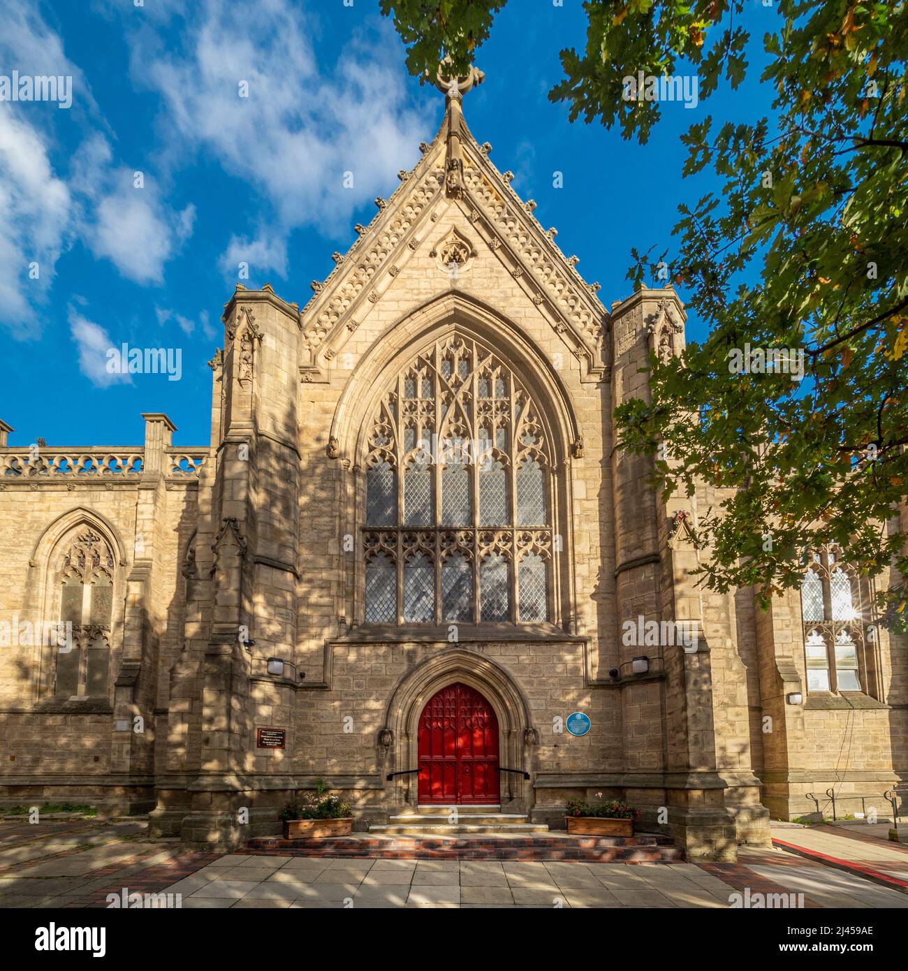 West facade of Mill Hill Chapel, with its bright red doors. Park Row