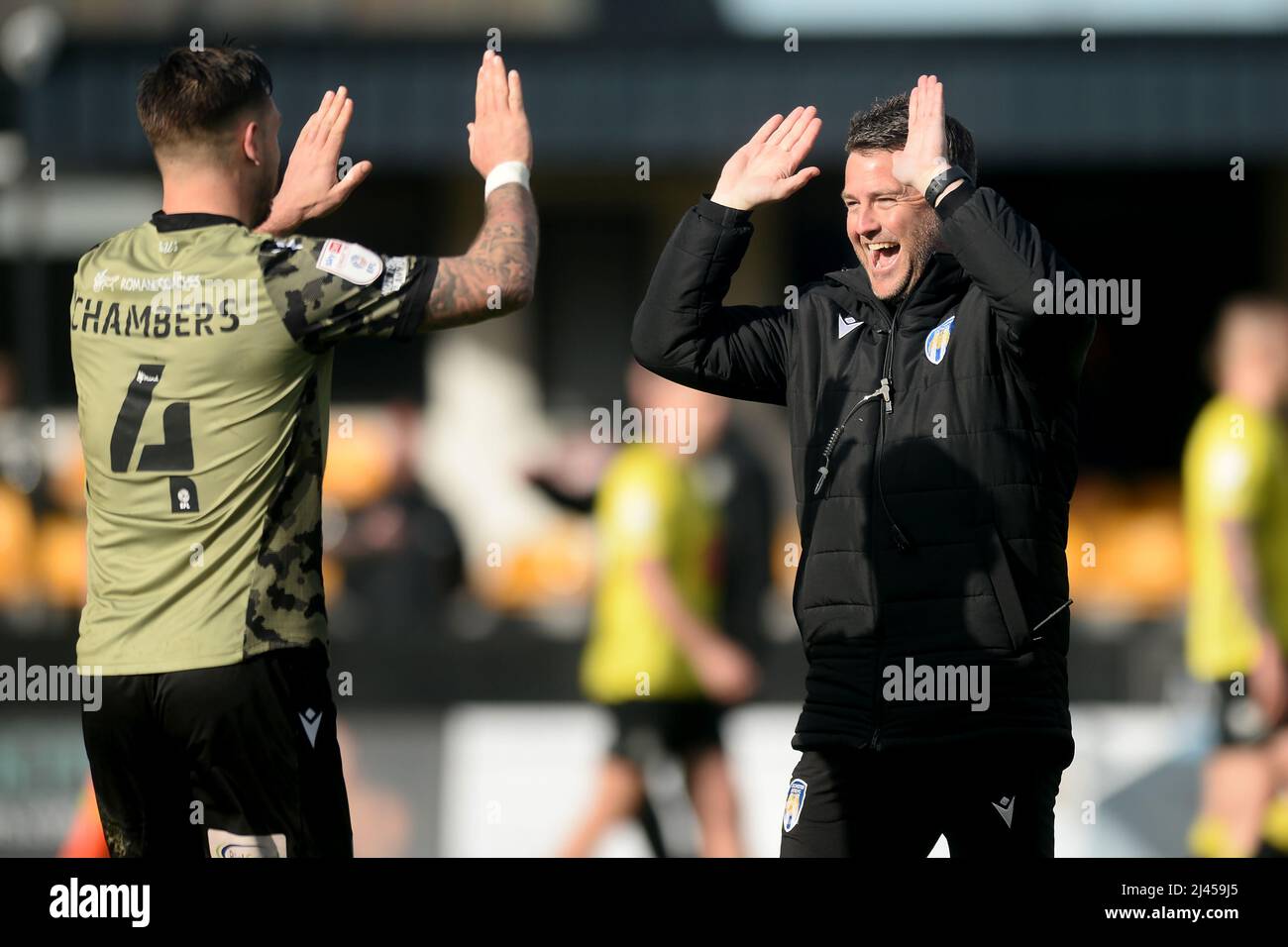 Luke Chambers of Colchester United celebrates at the final whistle with