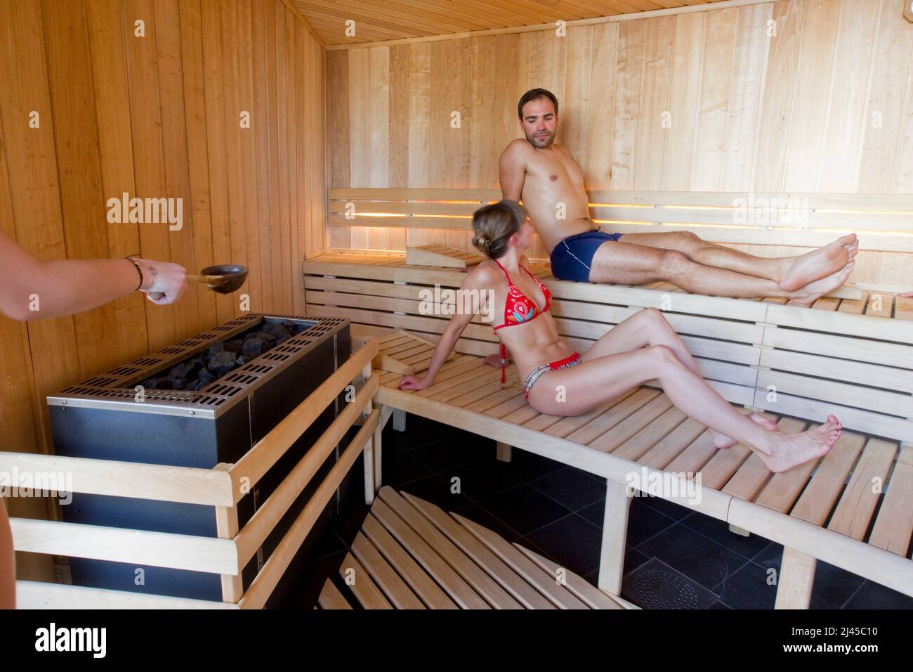 Hautes-Alpes department (Upper French Alps), Montgenevre (south-eastern France): illustration, one day in a spa and fitness centre. Man and woman in a Stock Photo