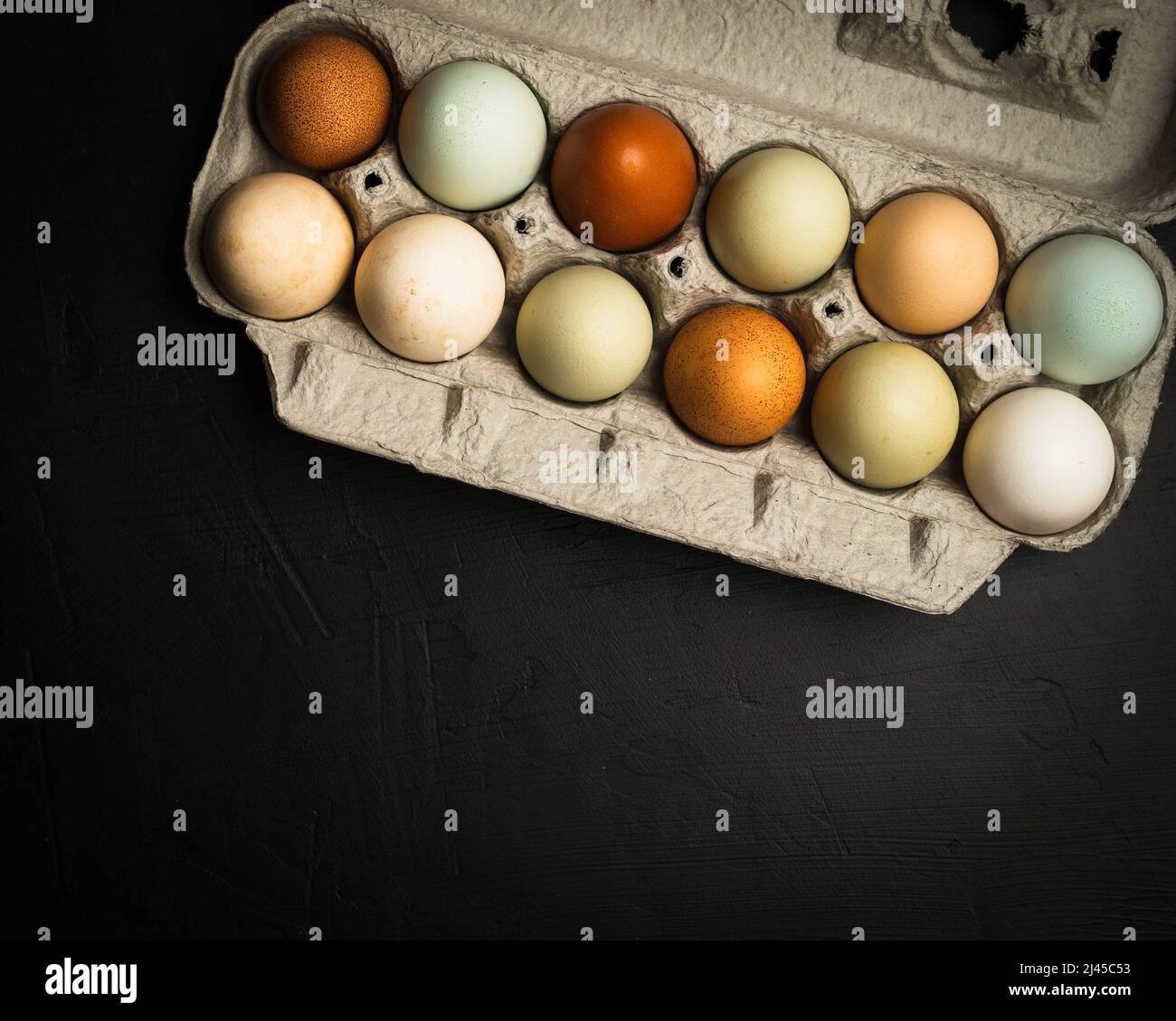 Fresh multicolored raw eggs Stock Photo