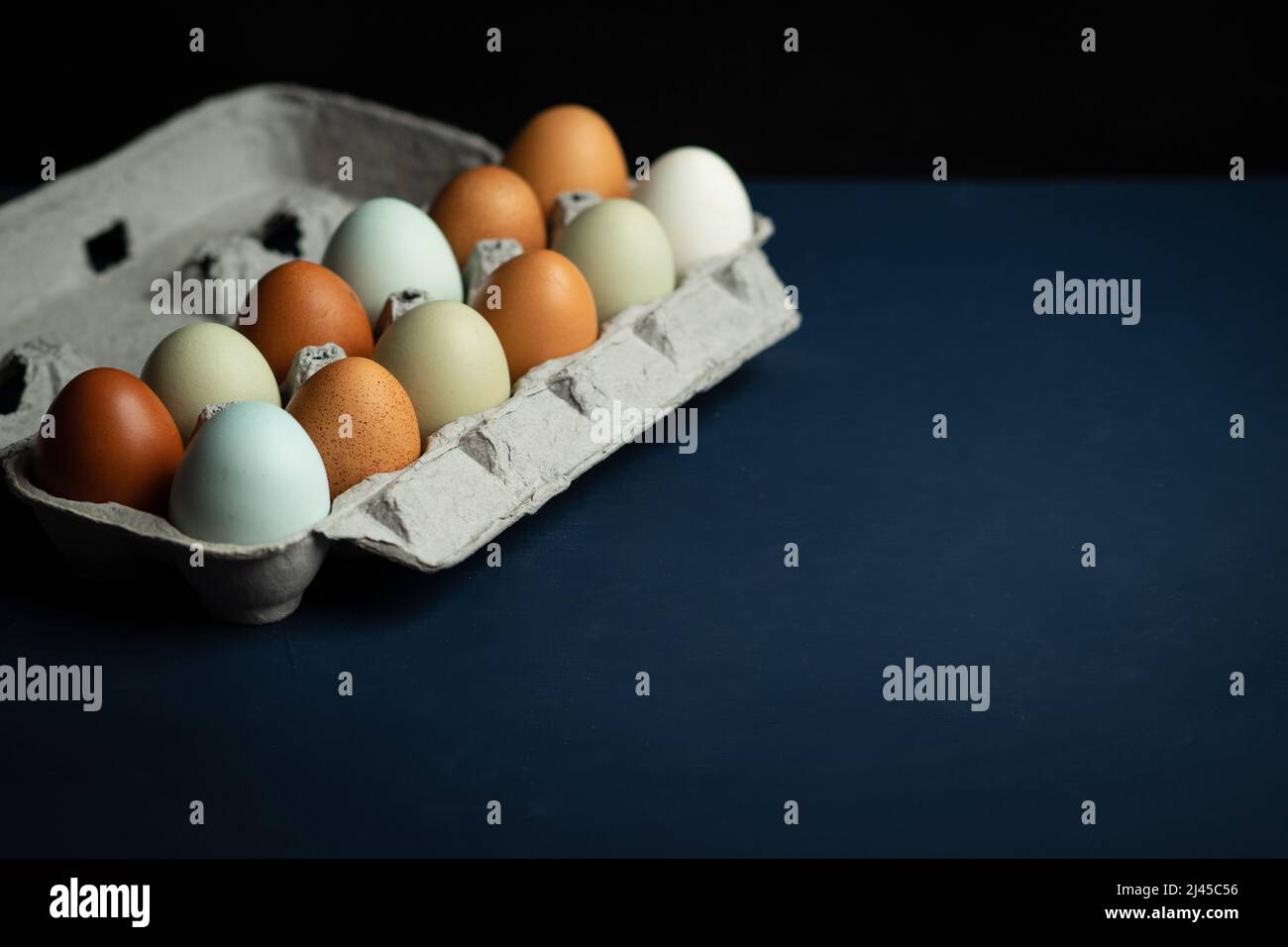 Fresh multicolored raw eggs Stock Photo
