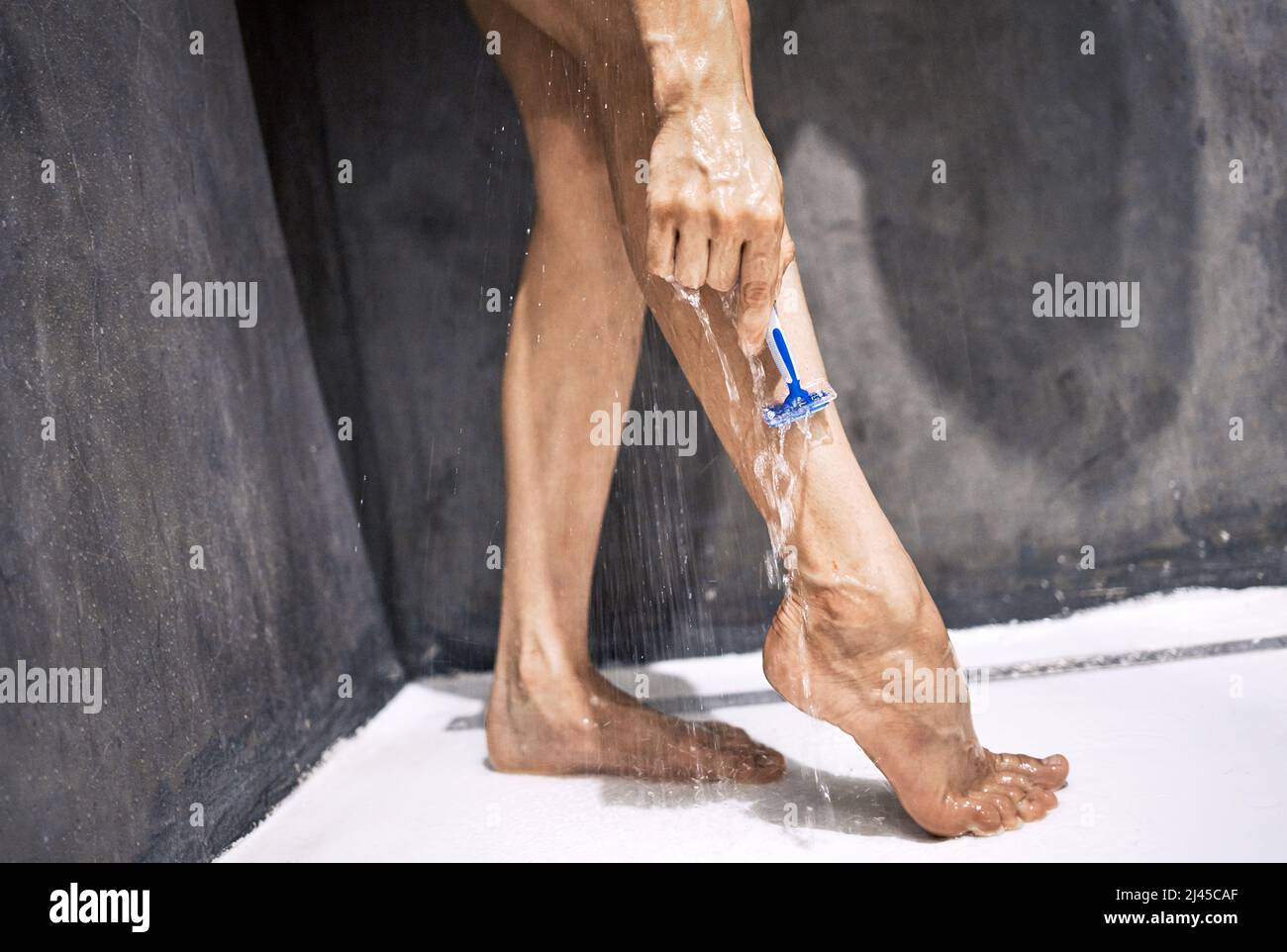 Its easier to shave in the shower. Cropped shot of an unrecognizable