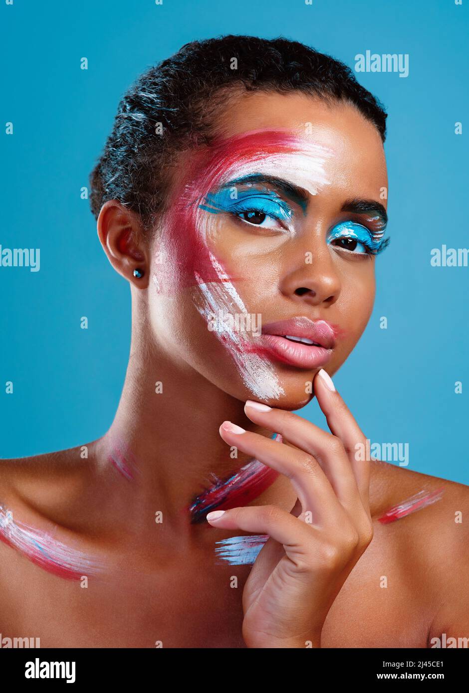 Well...colour me intrigued. Studio portrait of a beautiful young woman
