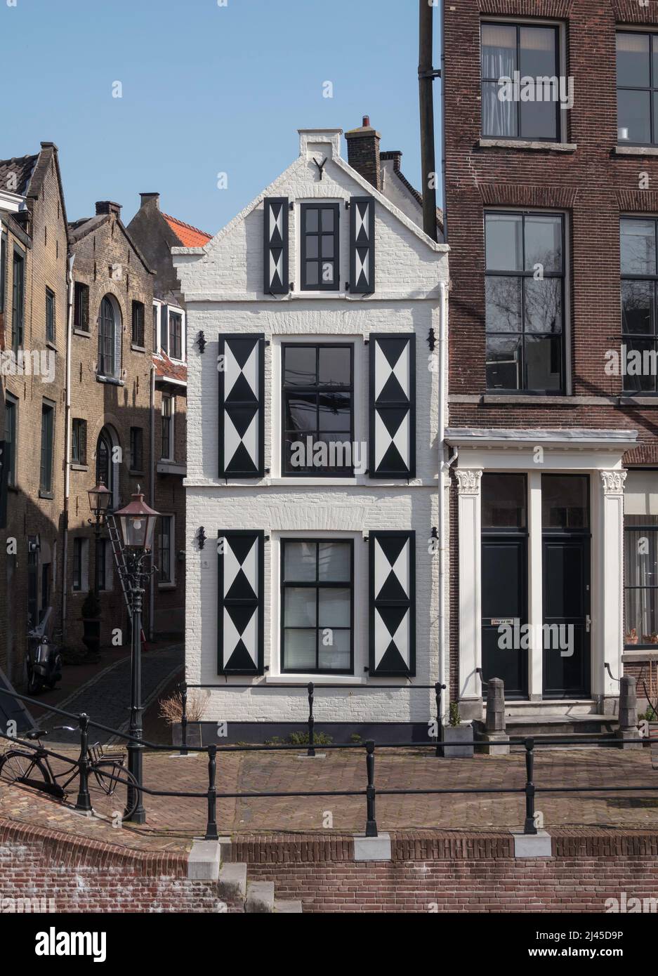 a very small white house in Schiedam Stock Photo