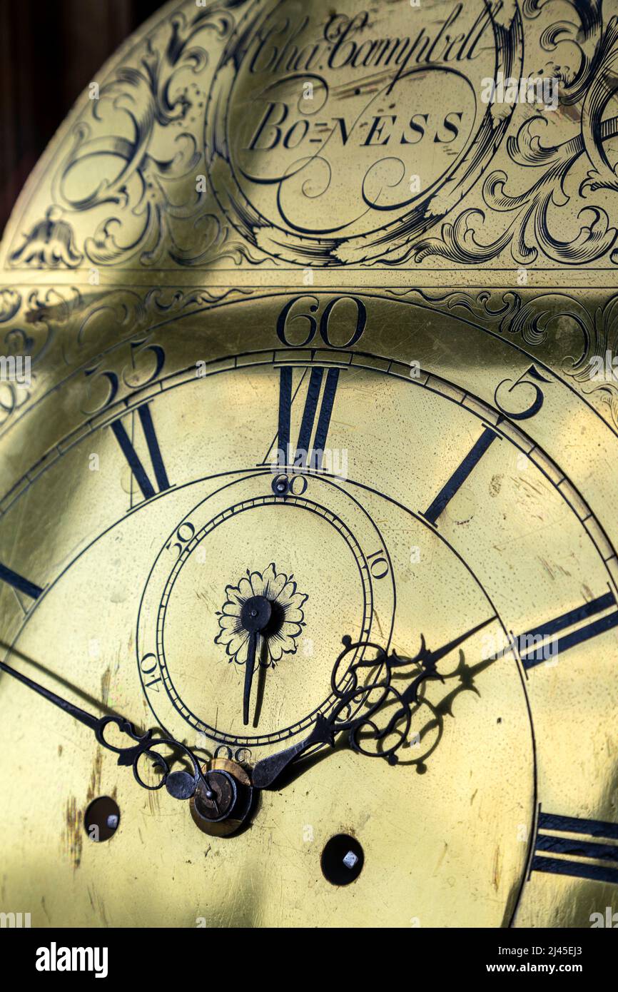 Clockface of an ornate antique clock with roman numerals Stock Photo