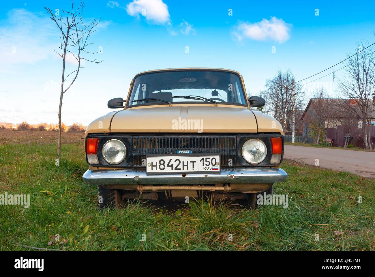 Moskvich 412 beige car in the field Stock Photo