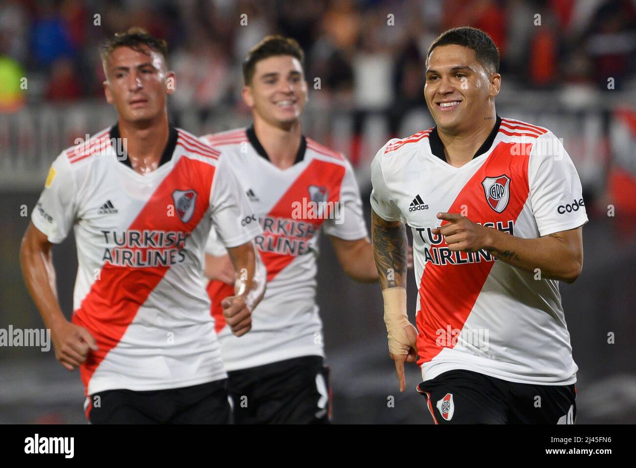 Juan Fernando Quintero (R) of River Plate celebrates his side's third goal during the match against Argentinos Juniors. Stock Photo