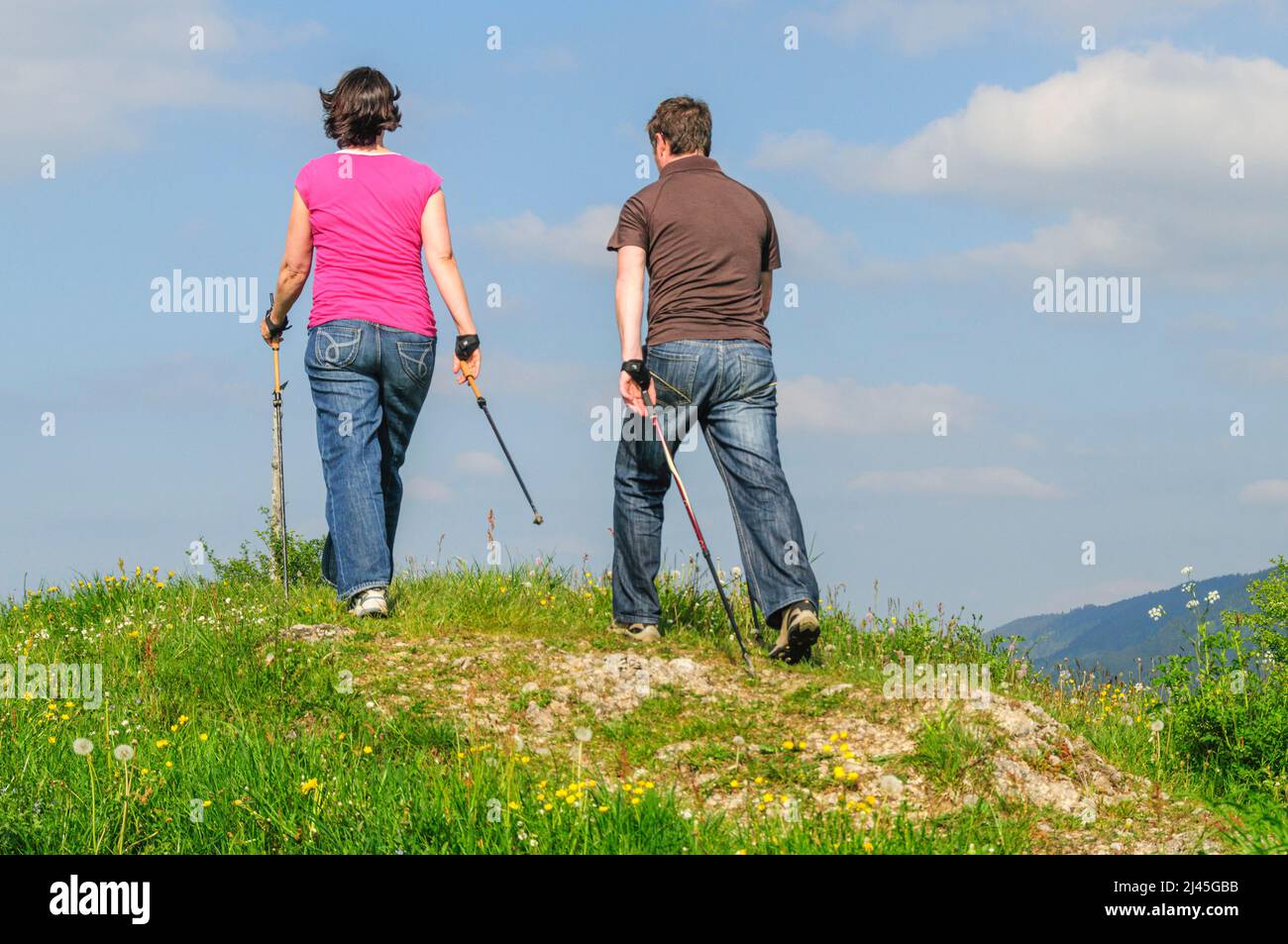 Relaxed Nordic Walking tour to the Dreiländerblick near Steibis, active together even during pregnancy Stock Photo