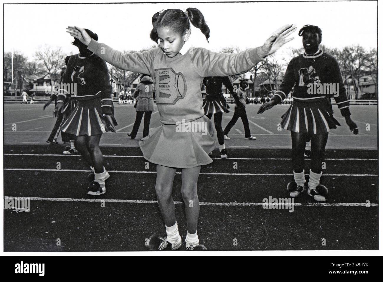 PAMELA. A young cheerleader mascot at a Bayside high school football game at Midwood Field in Brooklyn, New York City, 1982. Stock Photo