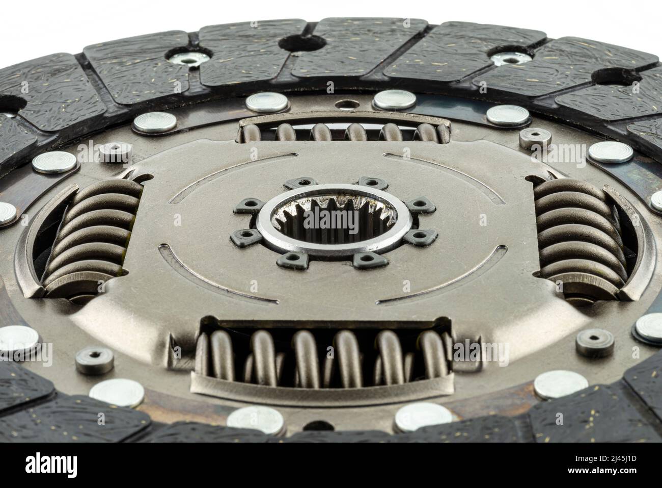 Used car clutch with damper springs and friction linings, isolated on a white background Stock