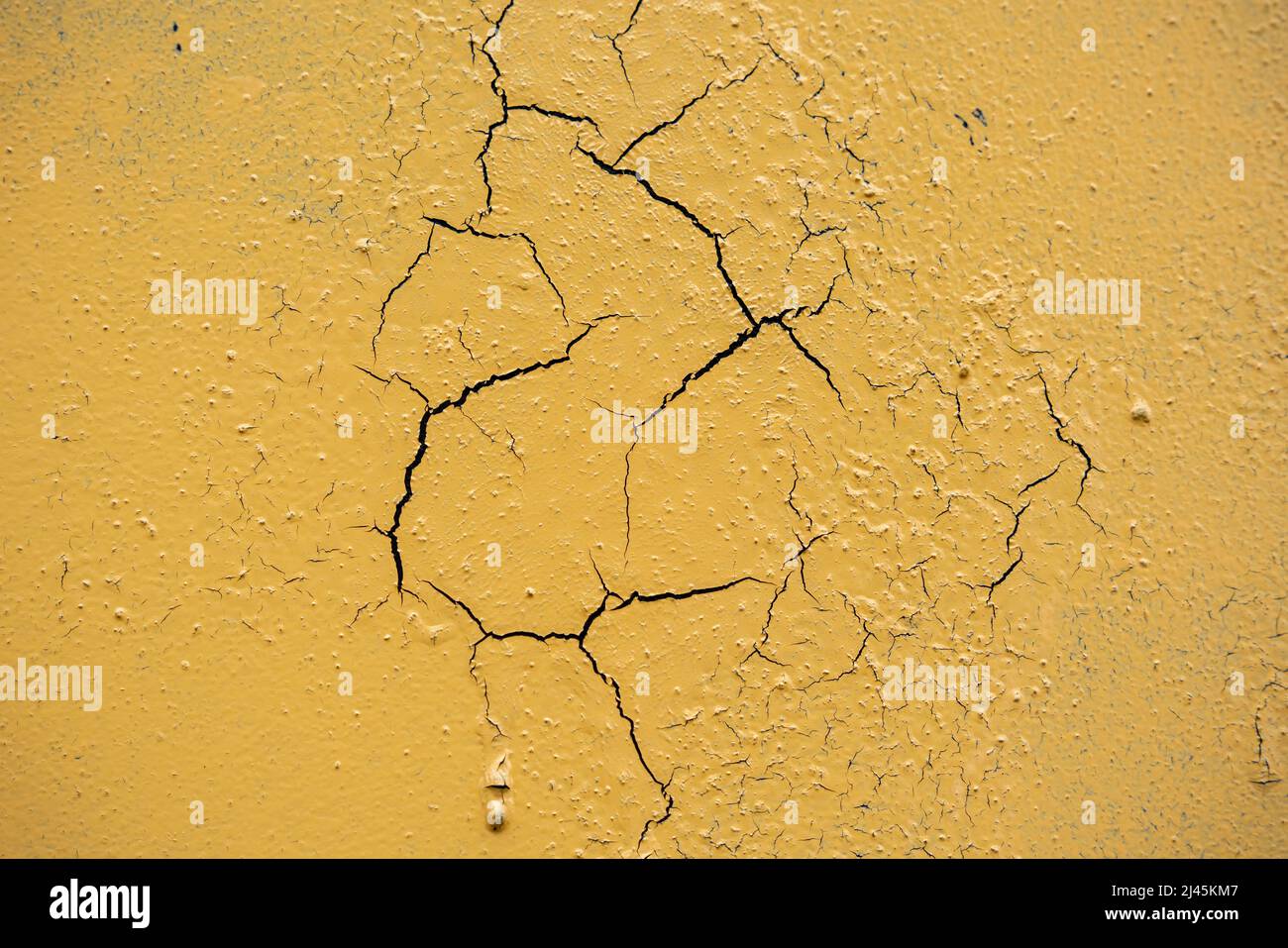 Cracked and damaged painted surface of a building or wall. Texture ...