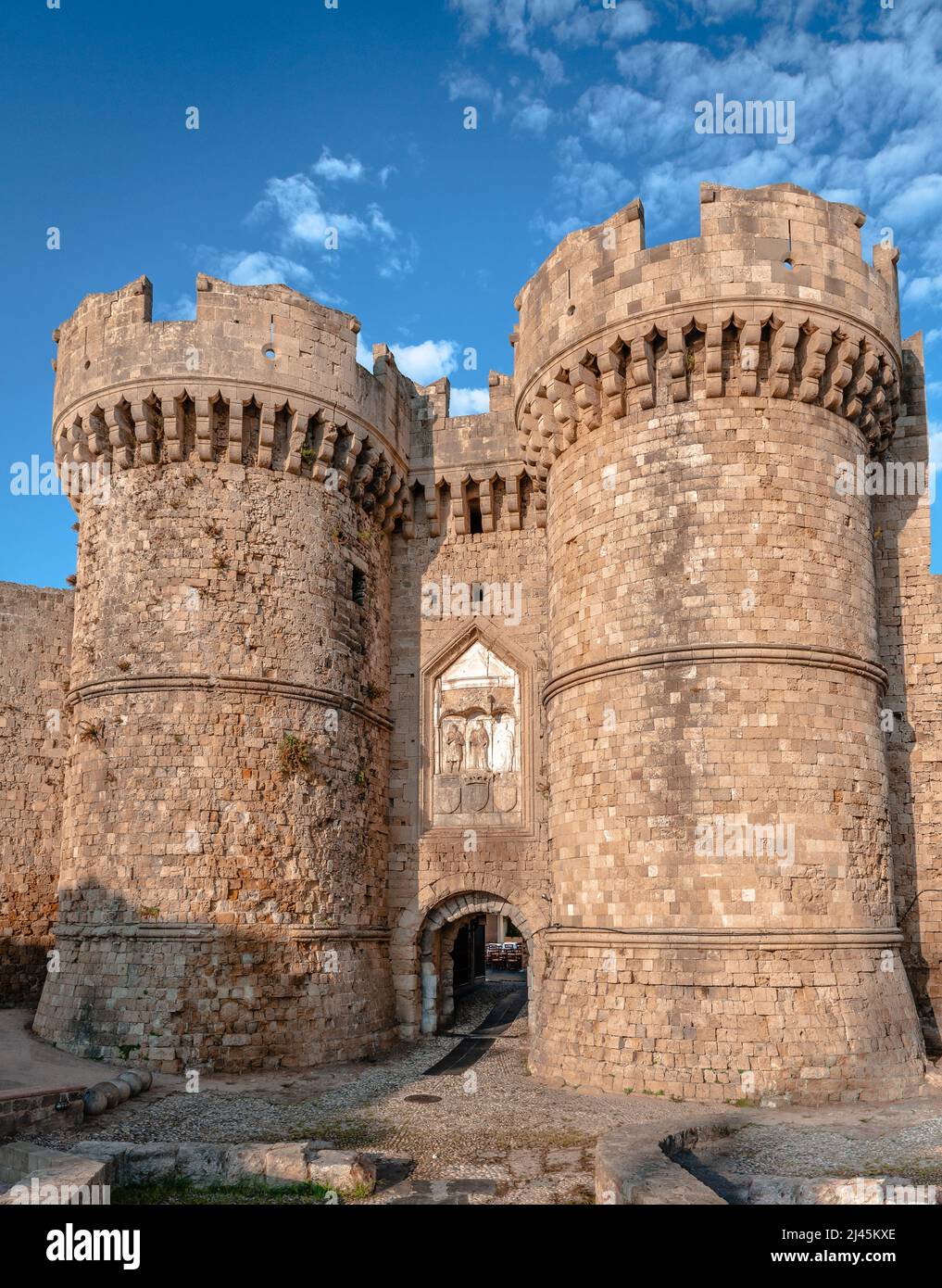 The Marine aka the Sea Gate with its defensive towers in Rhodes, Greece. It is the main entrance to the medieval town from the harbour. Stock Photo