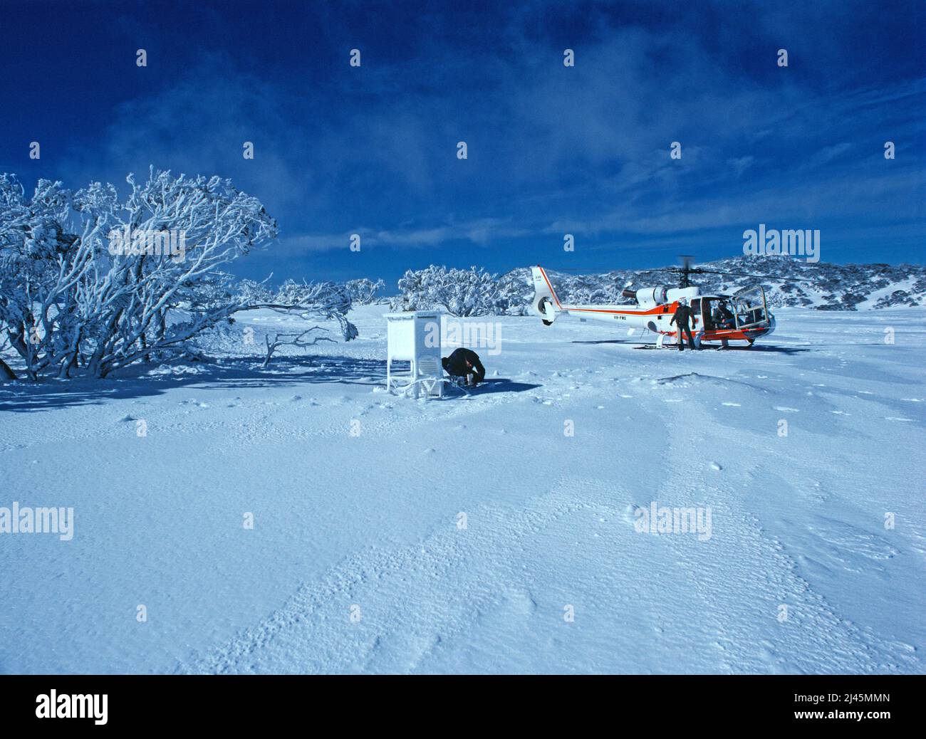Australia. New South Wales. Charlotte Pass. Winter. Meteorologists with helicopter. Stock Photo