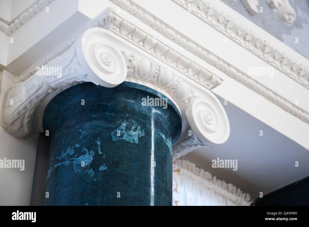 Classical portico fragment with pillar top. Old classic architecture