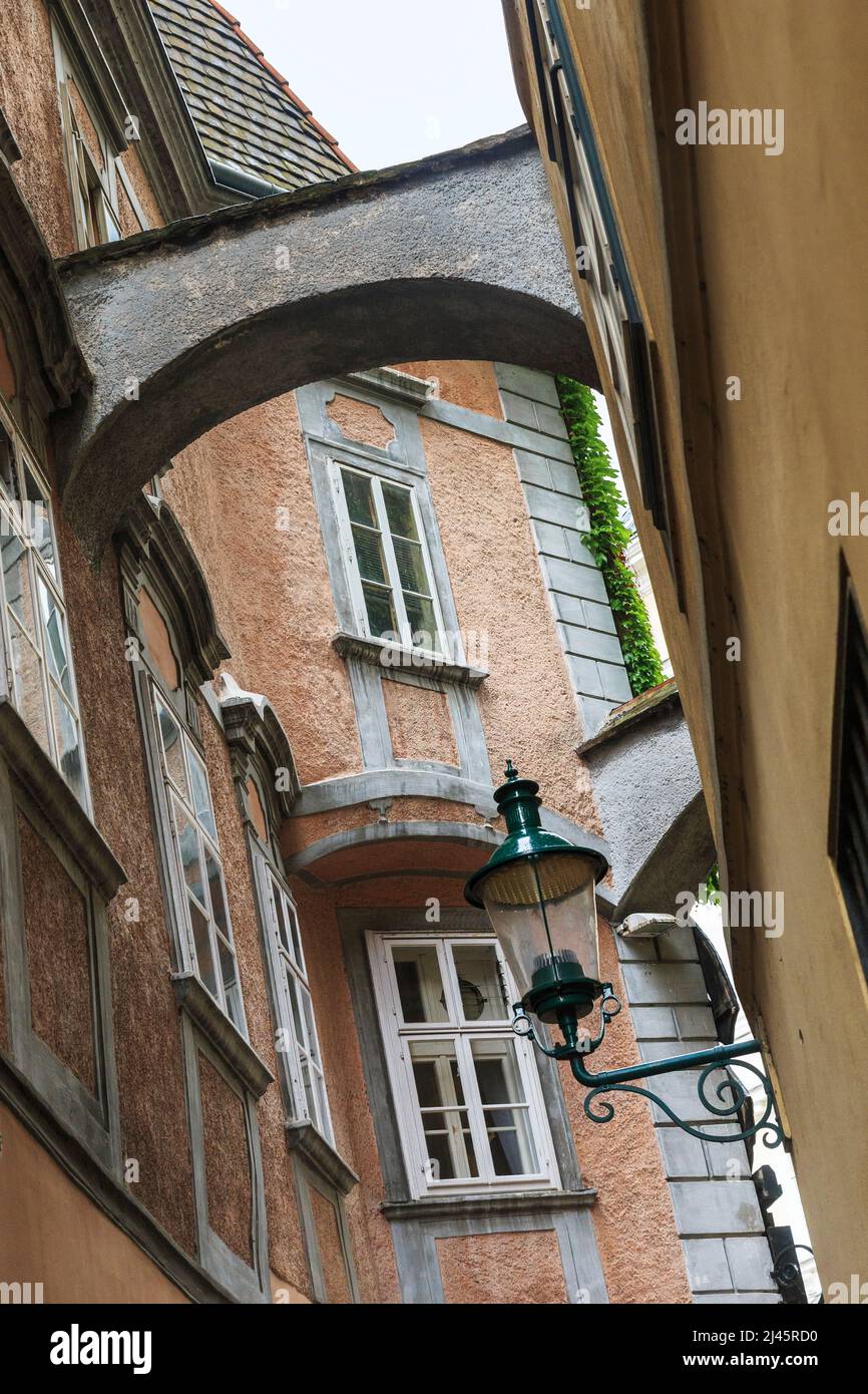 VIENNA, AUSTRIA - MAY 22, 2019: This is a narrow lane in the Inner City with arched lintels between the houses. Stock Photo