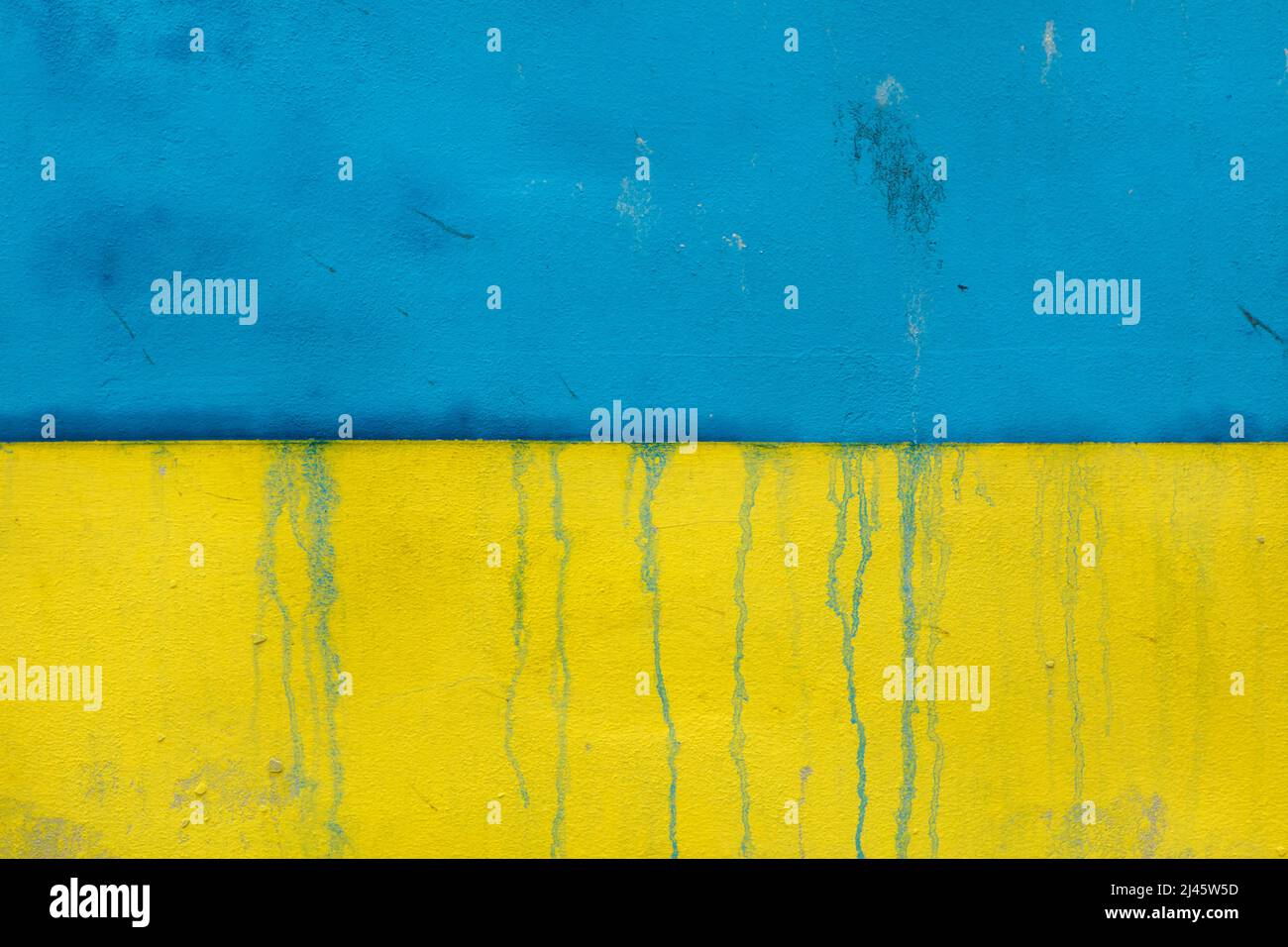 Ukrainian national flag depicted on the wall in Prague, Czech Republic. The huge flag was depicted to support Ukrainian refugees in the Czech Republic and to protest against the Russian invasion of Ukraine in 2022. Stock Photo