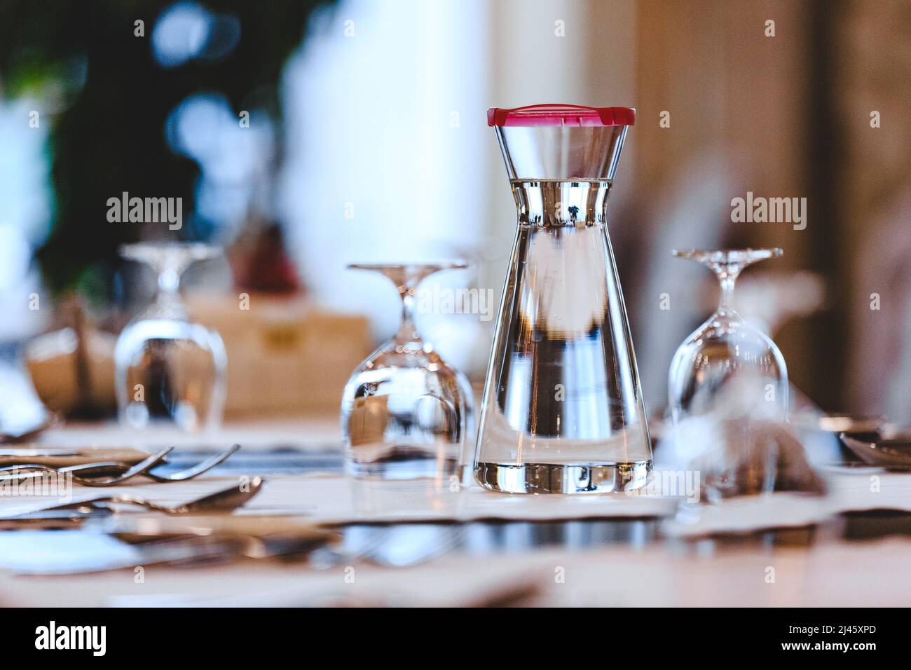 Water jug on a table in a restaurant Stock Photo - Alamy