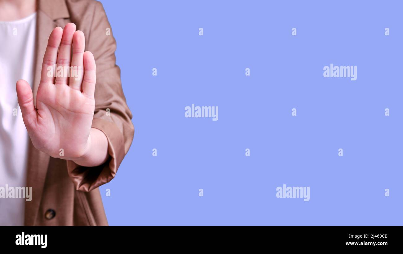 Stops Instructor Pin Woman teacher with stop hand gesture on studio blue background, banner ...