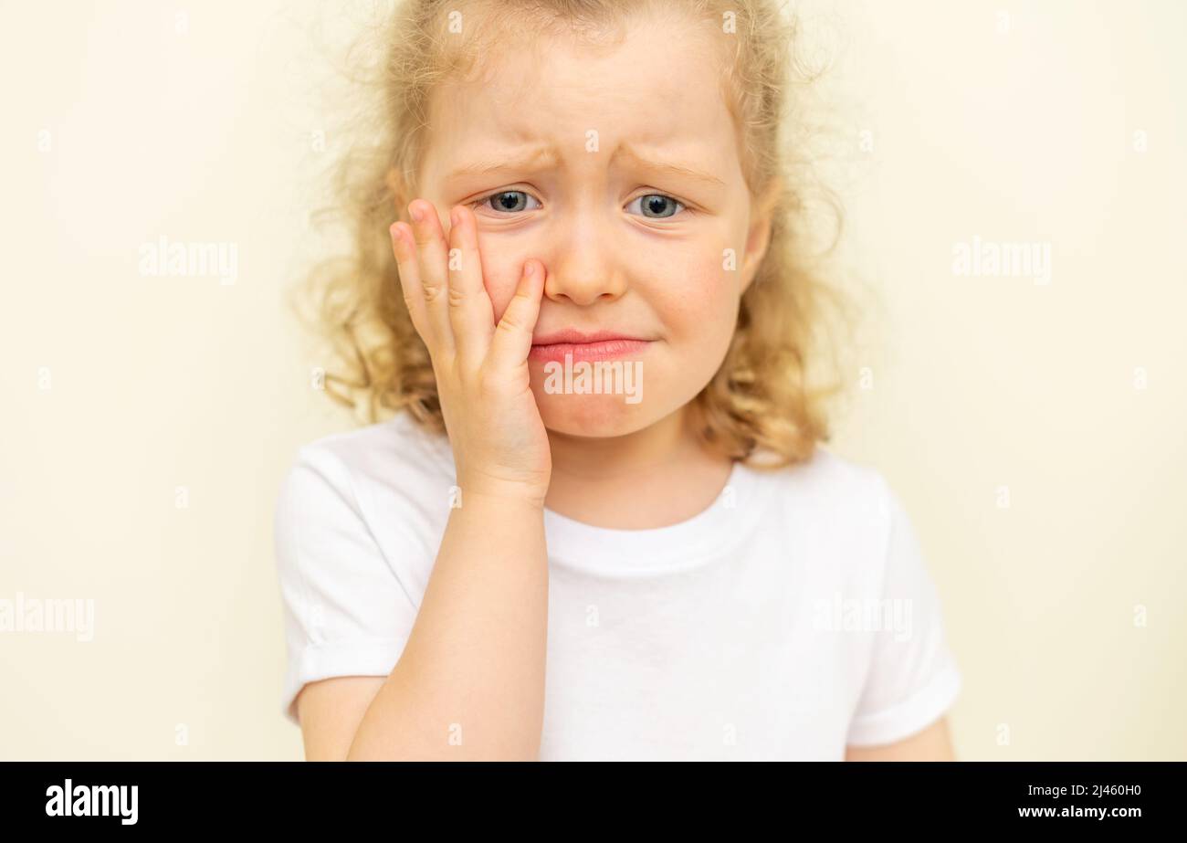 The child has a toothache. Children's caries Stock Photo Alamy