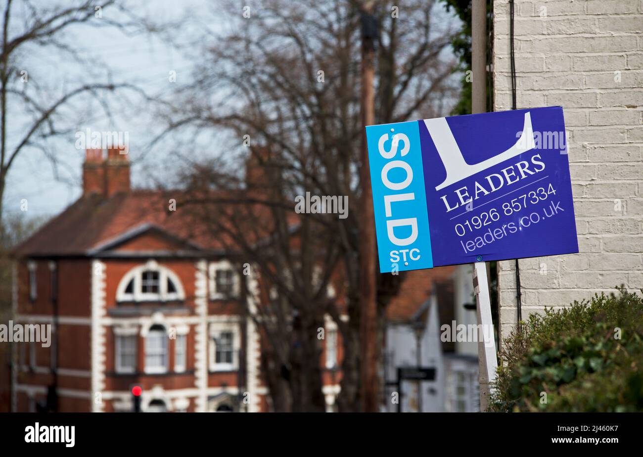 Estate agent's sign - house sold - on property in England UK Stock Photo
