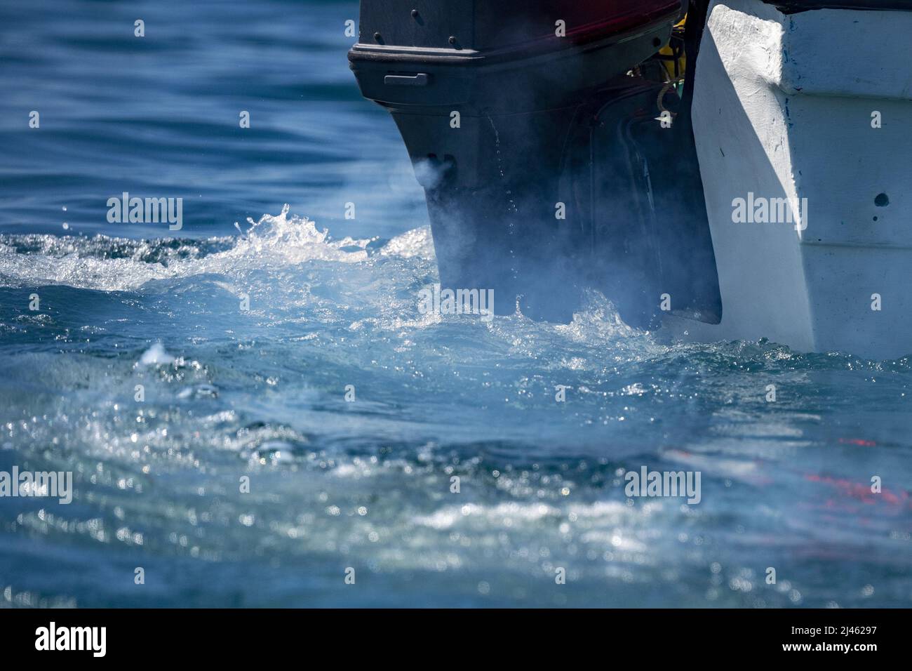 motor boat engine smoke on water detail close up Stock Photo Alamy